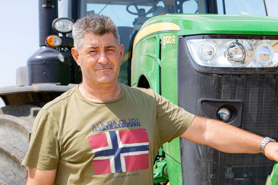 Agricultural equipment being loaded for transport